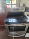 FRIGIDAIRE 30 INCH FREESTANDING 5 BURNER SMOOTH ELECTRIC RANGE CONVECTION QUICK PREHEAT STEAM CLEAN OR SELF CLEAN OPTIONS BLACK AND STAINLESS FRONT LOCATED IN OUR PORTLAND OREGON APPLIANCE STORE SKU 19302
