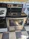 WHIRLPOOL 30 INCH FREESTANDING SMOOTH TOP ELECTRIC RANGE 4 BURNER 1 LARGE DUAL 1 LARGE 2 SMALL SELF CLEANING OVEN BLACK AND STAINLESS LOCATED IN OUR PORTLAND OREGON APPLIANCE STORE SKU 19312