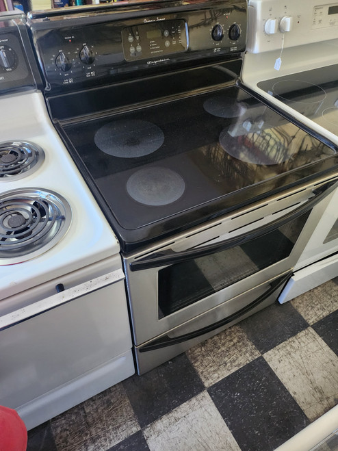 FRIGIDAIRE 30 INCH FREESTANDING SMOOTH TOP ELECTRIC RANGE 4 BURNER 2 LARGE 2 SMALL SELF CLEANING OVEN STAINLESS FRONT AND BLACK TOP AND SIDES STORAGE DRAWER SKU 19318