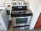 WHIRLPOOL 30 INCH FREESTANDING GLASS TOP RANGE 4 BURNES 2 LARGE DUAL 2 SMALL SELF CLEAN PLUS KEEP WARM SETTING STAINLESS BLACK LOCATED IN OUR PORTLAND OREGON APPLIANCE STORE SKU 19326