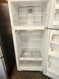 GE 16 CUBIC FOOT REFRIGERATOR TOP FREEZER WIRE SHELVES WITH 2 CRISPER DRAWERS GLASS COVER FULL WIDTH WIRE SHELF IN FREEZER WHITE LOCATED IN OUR PORTLAND OREGON APPLIANCE STORE SKU 19346