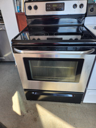 FRIGIDAIRE 30 INCH FREESTANDING ELECTRIC RANGE GLASS TOP 4 BURNER SELF CLEANING RANGE BLACK AND STAINLESS LOCATED IN OUR PORTLAND OREGON APPLIANCE STORE SKU 19349