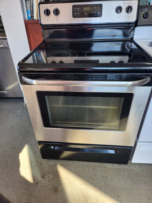 FRIGIDAIRE 30 INCH FREESTANDING ELECTRIC RANGE GLASS TOP 4 BURNER SELF CLEANING RANGE BLACK AND STAINLESS LOCATED IN OUR PORTLAND OREGON APPLIANCE STORE SKU 19349