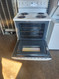 HOTPOINT 30 INCH ELECTRIC FREESTANDING RANGE MANUAL CLEAN OVEN COIL BURNERS 2 SMALL 2 LARGE WHITE LOCATED IN OUR PORTLAND OREGON APPLIANCE STORE SKU 19367