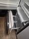 JENN-AIR 20 CUBIC FOOT COUNTER REFRIGERATOR WITH ICE AND WATER ADJUSTABLE GLASS 2 CRISPER DRAWERS 1 LARGE DELI PULL OPEN FREEZER FEW DINGS TOP OF FREEZER DOOR STAINLESS LOCATED IN OUR PORTLAND OREGON APPLIANCE STORE SKU 19392