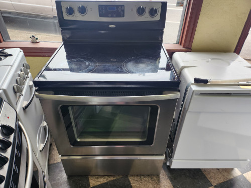 WHIRLPOOL 30 INCH FFEESTANDING ELECTRIC RANGE SMOOTH TOP 4 BURNER 1 LARGE DUAL 1 LARGE 2 SMALL SELF CLEANING OVEN BLACK AND STAINLESS LOCATED IN OUR PORTLAND OREGON APPLIANCE STORE SKU 19396