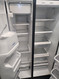 WHIRLPOOL 25 CUBIC FOOT SIDE BY SIDE REFRIGERATOR WITH ICE AND WATER GLASS SHELVES 3 WIRE SHELVES AND PULL OUT BASKET IN FREEZER BLACK LOCATED IN OUR PORTLAND OREGON APPLIANCE STORE SKU 19415