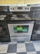 ESTATE BY WHIRLPOOL 30 INCH FREESTANDING ELECTRIC RANGE 4 COIL BURNERS 2 LARGE 2 SMALL SELF CLEANING OVEN COSMETIC ISSUES ON CONTROL PANEL SILVER AND BLACK LOCATED IN OUR PORTLAND OREGON APPLIANCE STORE SKU 19434