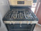 FRIGIDAIRE 30 INCH STANDING 5 BURNER PROPANE GAS RANGE STEAM AND SELF CLEANING OVEN QUICK BAKE SETTING STAINLESS AND BLACK LOCATED IN OUR PORTLAND OREGON APPLIANCE STORE SKU 19455