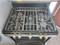 FRIGIDAIRE 30 INCH STANDING 5 BURNER PROPANE GAS RANGE STEAM AND SELF CLEANING OVEN QUICK BAKE SETTING STAINLESS AND BLACK LOCATED IN OUR PORTLAND OREGON APPLIANCE STORE SKU 19455