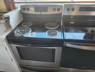 FRIGIDAIRE 30 INCH FREESTANDING ELECTRIC RANGE 4 COIL BURNERS 2 LARGE 2 SMALL SELF CLEANING OVEN WARM AND HOLD OPTION STORAGE DRAWER BLACK AND STAINLESS LOCATED IN OUR PORTLAND OREGON APPLIANCE STORE 19460