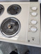 GE 30 INCH ELECTRIC COOKTOP 4 BURNERS 2 LARGE 2 SMALL ALMOND LOCATED IN OUR PORTLAND OREGON APPLIANCE STORE SKU 19516