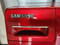 SAMSUNG FRONT LOAD WASHER WITH PEDESTAL 11 CYCLE SETTINGS 4 TEMPERATURES 3 SPEED PLUS NO SPIN 3 SOIL OPTIONS RED LOCATED IN OUR POTLAND OREGON APPLIANCE STORE SKU 19524