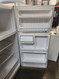HOTPOINT REFRIGERATOR 14 CUBIC FOOT TOP FREEZER WIRE SHELVES 2 CRISPER DRAWERS COSMETIC ISSUES ON DOORS WHITE LOCATED IN OUR PORTLAND OREGON APPLIANCE STORE SKU 19543