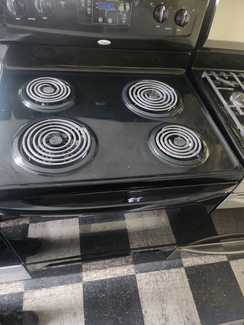 WHIRLPOOL 30 INCH FREESTANDING ELECTRIC RANGE MANUAL CLEAN COIL BURNES 2 LARGE 2 SMALL BLACK LOCATED IN OUR PORTLAND OREGON APPLIANCE STORE SKU 19546