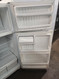 GE 15 CUBIC FOOT REFRIGERATOR TOP FREEZER ADJUSTABLE WIRE SHELVES 2 CRISPE DRAWERS WHITE COSMETIC ISSUES ON THE BOTTOM OF REFRIGERATOR DOOR LOCATED IN OUR PORTLAND OREGON APPLIANCE STORE LOCATED IN OUR POTLAND OREGON APPLIANCE STORE SKU 19571
