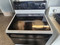 FRIGIDAIRE  30 INCH FREESTANDING GLASS TOP ELECTRIC RANGE 4 BURNER SELF CLEANING COSMETIC ISSUES ON CONTROL PANEL AND TOP SEE PICS WHITE WITH BLACK GLASS DOOR LOCATED IN OUR PORTLAND OREGON APPLIANCE STORE SKU 19600 FRIGIDAIRE  30 INCH FREESTANDING GLASS TOP ELECTRIC RANGE 4 BURNER SELF CLEANING COSMETIC ISSUES ON CONTROL PANEL AND TOP SEE PICS WHITE WITH BLACK GLASS DOOR LOCATED IN OUR PORTLAND OREGON APPLIANCE STORE SKU 19600