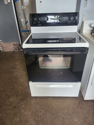 FRIGIDAIRE  30 INCH FREESTANDING GLASS TOP ELECTRIC RANGE 4 BURNER SELF CLEANING COSMETIC ISSUES ON CONTROL PANEL AND TOP SEE PICS WHITE WITH BLACK GLASS DOOR LOCATED IN OUR PORTLAND OREGON APPLIANCE STORE SKU 19600