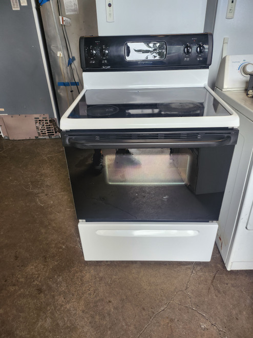FRIGIDAIRE  30 INCH FREESTANDING GLASS TOP ELECTRIC RANGE 4 BURNER SELF CLEANING COSMETIC ISSUES ON CONTROL PANEL AND TOP SEE PICS WHITE WITH BLACK GLASS DOOR LOCATED IN OUR PORTLAND OREGON APPLIANCE STORE SKU 19600 FRIGIDAIRE  30 INCH FREESTANDING GLASS TOP ELECTRIC RANGE 4 BURNER SELF CLEANING COSMETIC ISSUES ON CONTROL PANEL AND TOP SEE PICS WHITE WITH BLACK GLASS DOOR LOCATED IN OUR PORTLAND OREGON APPLIANCE STORE SKU 19600