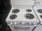 GE 30 INCH FREESTANDING ELECTRIC RANGE FRONT CONTROLS 4 COIL BURNERS 2 LARGE 2 SMALL MANUAL CLEAN OVEN WHITE LOCATED IN OUR PORTLAND OREGON APPLIANCE STORE SKU 19620