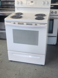 FRIGIDAIRE 30 INCH FREESTANDING ELECTRIC RANGE COIL BURNERS 2 LARGE 2 SMALL SELF CLEANING OVEN TOP OF OVEN DOOR HAS COSMETIC ISSUES SEE PIC WHITE LOCATED IN OUR PORTLAND OREGON APPLIANCE STORE SKU 19629