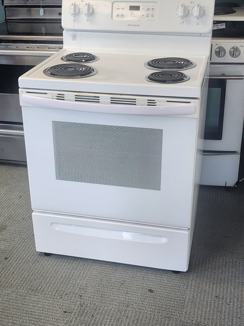 FRIGIDAIRE 30 INCH FREESTANDING ELECTRIC RANGE COIL BURNERS 2 LARGE 2 SMALL SELF CLEANING OVEN TOP OF OVEN DOOR HAS COSMETIC ISSUES SEE PIC WHITE LOCATED IN OUR PORTLAND OREGON APPLIANCE STORE SKU 19629