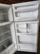 GE 18 CUBIC FOOT REFRIGERATOR TOP FREEZER ADJUSTABLE WIRE SHELVES 2 CRISPER DRAWERS WITH GLASS COVER FULL WIDTH WIRE SHELF IN FREEZER WHITE LOCATED IN OUR PORTLAND OREGON APPLIANCE STORE SKU 19587