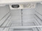 GE 18 CUBIC FOOT REFRIGERATOR TOP FREEZER ADJUSTABLE WIRE SHELVES 2 CRISPER DRAWERS WITH GLASS COVER FULL WIDTH WIRE SHELF IN FREEZER WHITE LOCATED IN OUR PORTLAND OREGON APPLIANCE STORE SKU 19587