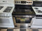 KENMORE 30 INCH FREESTANDING 5 BURNER GLASS TOP ELECTRIC RANGE WARMING DRAWER 1 LARGE DUAL CENTER WARMING BURNER 1 LARGE 2 SMALL WARM AND HOLD OPTION BLACK AND STAINLESS LOCATED IN OUR PORTLAND OREGON APPLIANCE STORE SKU 19590