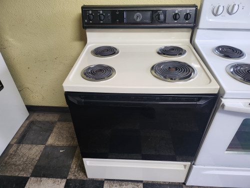 GE 30 INCH ELECTRIC FREESTANDING RANGE COIL BURNERS 2 SMALL 2 LARGE MANUAL CLEAN ALMOND WITH BLACK GLASS OVEN DOOR LOCATED IN OUR PORTLAND OREGON APPLIANCE STORE SKU 19713