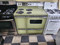 GE VINTAGE 40 INCH DOUBLE OVEN COIL BURNERS 2 LARGE 2 SMALL PUSH BUTTON SWITCHES WINDOW IN LARGE OVEN DOOR 2 STORAGE DRAWERS AVOCADO GREEN LOCATED IN OUR PORTLAND OREGON APPLIANCE STORE SKU 19719
