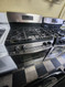 GE FREESTANDING 4 BURNER GAS RANGE HEAVY DUTY BURNER GRATES HI-LO BROIL SETTING SELF CLEANING OVEN BLACK AND STAINLESS LOCATED IN OUR PORTLAND OREGON APPLIANCE STORE SKU 19723