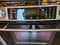 Jenn Air Slide-In Downdraft Gas Range with 4 Sealed Burners, 15,000 BTU Even Three Burner, 4.3 cu. ft. Multi Mode Convection and 2-Speed Ventilation Fan: Black Floating Glass LOCATED IN OUR PORTLAND APPLIANCE STORE SKU 19822