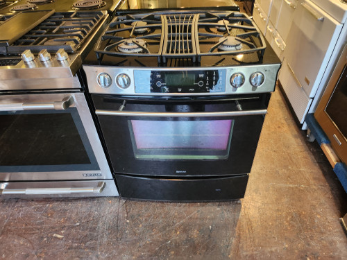 Jenn Air Slide-In Downdraft Gas Range with 4 Sealed Burners, 15,000 BTU Even Three Burner, 4.3 cu. ft. Multi Mode Convection and 2-Speed Ventilation Fan: Black Floating Glass LOCATED IN OUR PORTLAND APPLIANCE STORE SKU 19822
