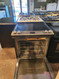 WHIRLPOOL 30 INCH SLIDE-IN SMOOTH TOP ELECTRIC RANGE 5 BURNER CENTER BURNER IS A WARMING BURMER CONVECTION WITH AQUA LIFT SELFCLEAN COSMETIC ISSUES ON OVEN LINER DISCOLORED STAINLESS AND BLACK LOCATED IN OUR PORTLAND OREGON APPLIANCE STORE SKU 19901