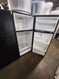 GE 28 Inch Top Freezer Refrigerator with 17.5 Cu. Ft. Total Capacity, Adjustable Edge to Edge Glass Shelves, Sliding Deli Drawer, LED Lighting, Spillproof Freezer Floor, Gallon Door Storage BLACK LOCATED IN OUR PORTLAND OREGON APPLIANCE STORE SKU 19914