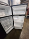 GE 28 Inch Top Freezer Refrigerator with 17.5 Cu. Ft. Total Capacity, Adjustable Edge to Edge Glass Shelves, Sliding Deli Drawer, LED Lighting, Spillproof Freezer Floor, Gallon Door Storage BLACK LOCATED IN OUR PORTLAND OREGON APPLIANCE STORE SKU 19914