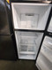 GE 28 Inch Top Freezer Refrigerator with 17.5 Cu. Ft. Total Capacity, Adjustable Edge to Edge Glass Shelves, Sliding Deli Drawer, LED Lighting, Spillproof Freezer Floor, Gallon Door Storage BLACK LOCATED IN OUR PORTLAND OREGON APPLIANCE STORE SKU 19914