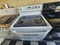 GE 30 INCH FREESTANDING GLASS TOP ELECTRIC RANGE 4 BURNER 2 LARGE 2 SMALL HI -LO BROIL SETTING SELF CLEANING OVEN WHITE LOCATED IN OUR PORTLAND OREGON APPLIANCE STORE SKU 19922