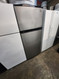 ESTATE BY WHIRLPOOL 18 CUBIC FOOT REFRIGERATOR TOP FREEZER GLASS SHELVES 2 CRISPER DRAWERS COSMETIC ISSUE ON REFRIGERATOR SEE PIC SILVER LOCATED IN OUR POTLAND OREGON APPLIANCE STORE SKU 19940