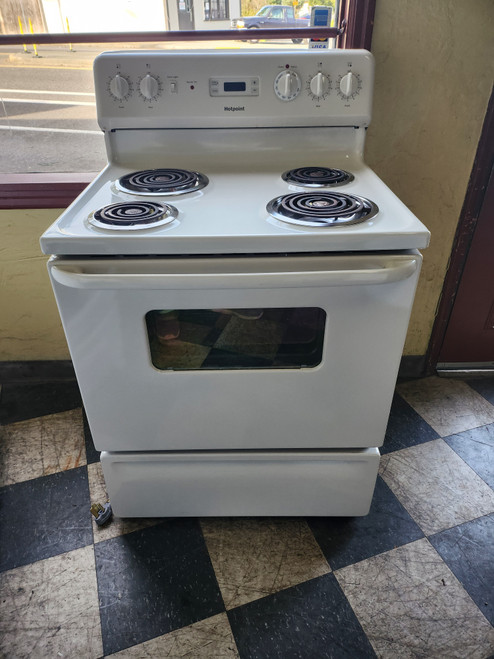 HOTPOINT 30 INCH FREESTANDING ELECTRIC RANGE COIL BURNERS 2 LARGE 2 SMALL MANUAL CLEAN OVEN WHITE LOCATED IN OUR PORTLAND OREGON APPLIANCE STORE SKU 19942