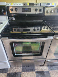 WHIRLPOOL 30 INCH FREESTANDING 4 BURNER GLASS TOP ELECTRIC RANGE SELF CLEANING OVEN BLACK STAINLESS LOCATED IN OUR PORTLAND OREGON APPLIANCE STORE SKU 19964