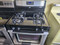 WHIRLPOOL 4 BURNER FREESTANDING GAS RANGE KEEP WARM OPTION SELFING CLEANING OVEN BLACK STAINLESS COSMETIC ISSUES ON BURNER GRATES SEE PICS LOCATED IN OUR PORTLAND OREGON APPLIANCE STORE SKU 19965