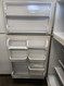 WHIRLPOOL 21 CUBIC FOOT REFRIGERATOR TOP FREEZER ADJUSTABLE GLASS SHELVES HUMIDITY CONTROLLED CRISPER DRAWERS WIRE SHELF IN FREEZER BISQUE LOCATED IN OUR PORTLAND OREGON APPLIANCE STORE SKU 19970