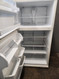 WHIRLPOOL 21 CUBIC FOOT REFRIGERATOR TOP FREEZER ADJUSTABLE GLASS SHELVES HUMIDITY CONTROLLED CRISPER DRAWERS WIRE SHELF IN FREEZER BISQUE LOCATED IN OUR PORTLAND OREGON APPLIANCE STORE SKU 19970