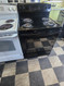 GE 30 INCH FREESTANDING ELECTRIC RANGE COIL BURNERS 2 SMALL 2 LARGE HI LO BROIL SETTING SELF CLEANING OVEN BLACK LOCATED IN OUR PORTLAND OREGON APPLIANCE STORE SKU 19984