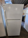 GE 18 CUBIC FOOT REFRIGERATOR TOP FREEZER 4 SPLIT ADJUSTABLE GLASS SHELVES 2 CRISPER DRAWERS WIRE SHELF IN FREEZER COSMETIC ISSUES ON DOOR SEE PICS WHITE LOCATED IN OUR PORTLAND OREGON APPLIANCE STORE SKU 20003