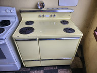 GE VINTAGE 40 INCH DOUBLE OVEN MANAUL CLEAN OVEN COIL BURNERS 3 SMALL 1 LARGE PUSH BUTTON BURNER SWITCHES 2 STORAGE DRAWERS PALE/ LEMON YELLOW LOCATED IN OUR PORTLAND OREGON APPLIANCE STORE SKU 20007