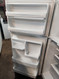GE 18 CUBIC FOOT REFRIGERATOR TOP FREEZER GLASS SHELVES 1 DELI DRAWER 2 CRISPER DRAWERS WIRE SHELF IN FREEZER COSMETIC ISSUE ON FEEZER DOOR SEE PIC WHITE LOCATED IN OUR PORTLAND OREGON APPLIANCE STORE SKU 20017