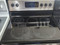 FRIGIDAIRE 30 INCH FREESTANDING 5 BURNER GLASS TOP ELECTRIC RANGE 1 LARGE DUAL CENTER WARMING SELF CLEANING BLACK AND STAINLESS LOCATED IN OUR PORTLAND OREGON APPLIANCE STORE SKU 20041